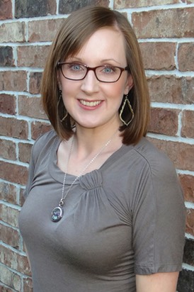 Melita Headshot2 wbackdrop.jpg